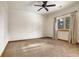 Simple bedroom with carpeted floor and ceiling fan at 590 Cumberland Rd, Larkspur, CO 80118