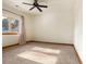 Spacious bedroom with carpeted floor and large window at 590 Cumberland Rd, Larkspur, CO 80118