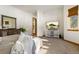 Comfortable bedroom with large window, built-in shelving, and a flat screen TV at 590 Cumberland Rd, Larkspur, CO 80118
