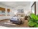 Spacious bedroom with large windows, plush bedding, and a cozy sitting area at 590 Cumberland Rd, Larkspur, CO 80118