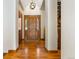 Bright entryway with hardwood floors and elegant wooden door at 590 Cumberland Rd, Larkspur, CO 80118