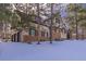 House exterior showcasing stone and stucco finishes, and a two-car garage at 590 Cumberland Rd, Larkspur, CO 80118