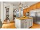 Spacious kitchen with large island, hardwood floors, and views to Gathering room at 590 Cumberland Rd, Larkspur, CO 80118