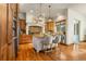 Gourmet kitchen with island, stainless steel appliances, and wood cabinetry at 590 Cumberland Rd, Larkspur, CO 80118