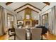 Spacious living room with vaulted ceilings, a stone fireplace and hardwood floors at 590 Cumberland Rd, Larkspur, CO 80118