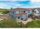 Aerial view of the rear exterior showcasing the patio, large yard and outdoor seating at 5238 Gould Cir, Castle Rock, CO 80109