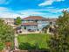 Spacious backyard featuring a lush lawn, patio seating area, and outdoor grilling space at 5238 Gould Cir, Castle Rock, CO 80109