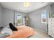 Neutral bedroom with a bookshelf, a window and carpeted floor at 5238 Gould Cir, Castle Rock, CO 80109