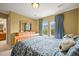 Comfortable bedroom featuring soft lighting, a wooden dresser, and a pleasant view at 5238 Gould Cir, Castle Rock, CO 80109
