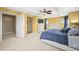 Yellow walls and large dresser are featured in this home's bedroom at 5238 Gould Cir, Castle Rock, CO 80109