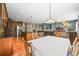Bright dining area features hardwood floors and opens to kitchen and living area at 5238 Gould Cir, Castle Rock, CO 80109
