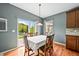 Dining area with sliding glass door to back yard and lots of natural light at 5238 Gould Cir, Castle Rock, CO 80109