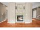 Living room fireplace with decorative tile surround and wood floors at 5238 Gould Cir, Castle Rock, CO 80109
