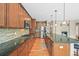 Modern kitchen features stainless steel appliances, granite countertops, and wooden cabinets at 5238 Gould Cir, Castle Rock, CO 80109