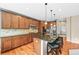 Kitchen with granite counters, center island, stainless appliances and wood cabinets at 5238 Gould Cir, Castle Rock, CO 80109