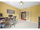 Bright office space with neutral carpet, a desk, a comfortable chair, and easy access to the hallway at 5238 Gould Cir, Castle Rock, CO 80109