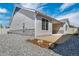 The backyard features gravel landscaping, and a quaint patio at 5150 N Quemoy Ct, Aurora, CO 80019