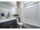 Bathroom showcasing a large vanity, a mirror, and a shower-tub combination at 5150 N Quemoy Ct, Aurora, CO 80019