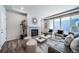Comfortable living room with fireplace, with sliding glass doors leading to the outdoor area at 5150 N Quemoy Ct, Aurora, CO 80019