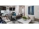 Open-concept living room seamlessly blends comfort and style, flowing into the kitchen and dining area at 5150 N Quemoy Ct, Aurora, CO 80019