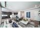 Spacious living room features modern decor, comfortable seating, and an open layout to the kitchen at 5150 N Quemoy Ct, Aurora, CO 80019
