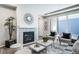 Bright and airy living room with a fireplace and sliding glass doors at 5150 N Quemoy Ct, Aurora, CO 80019