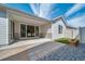 Picturesque covered patio features sliding glass doors, pavers and a cozy outdoor space at 5150 N Quemoy Ct, Aurora, CO 80019