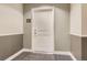 View of the apartment door with unit number 207 and carpeted flooring at 9019 E Panorama Cir # D207, Englewood, CO 80112