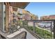 Outdoor balcony with chairs and small table is the perfect space to unwind and enjoy outdoor air at 9019 E Panorama Cir # D207, Englewood, CO 80112