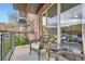 Relaxing outdoor balcony with chairs and small table to enjoy city view at 9019 E Panorama Cir # D207, Englewood, CO 80112