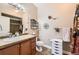 Bathroom features a vanity, sink, toilet and neutral colored walls at 9019 E Panorama Cir # D207, Englewood, CO 80112