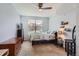 Cozy bedroom features a ceiling fan and window bringing in natural light at 9019 E Panorama Cir # D207, Englewood, CO 80112
