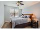 Bedroom with plush carpet, gray walls, a ceiling fan, and natural lighting at 9019 E Panorama Cir # D207, Englewood, CO 80112