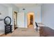 Bedroom leading to the bathroom features neutral walls and carpet throughout at 9019 E Panorama Cir # D207, Englewood, CO 80112