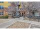 Apartment building entrance featuring well-maintained landscaping and handicap access in the front at 9019 E Panorama Cir # D207, Englewood, CO 80112