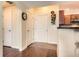 Entryway boasts hardwood floors, access to a kitchen, and a coat closet at 9019 E Panorama Cir # D207, Englewood, CO 80112