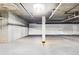 Spacious garage with concrete walls and ceiling ready to be used or renovated for other possibilities at 9019 E Panorama Cir # D207, Englewood, CO 80112