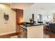 Open kitchen with black countertops, stainless dishwasher, and lots of counter space at 9019 E Panorama Cir # D207, Englewood, CO 80112