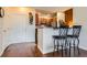 Open kitchen design with breakfast bar seating and stainless steel appliances at 9019 E Panorama Cir # D207, Englewood, CO 80112