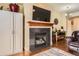 Inviting living room showcases fireplace with mantel, built-in storage and hardwood floors at 9019 E Panorama Cir # D207, Englewood, CO 80112