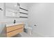 Clean bathroom with modern vanity, sink, and stylish shelving at 1601 Park Ave # 307, Denver, CO 80218