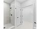 Bathroom showcasing a glass-enclosed shower with a rainfall showerhead and tile surround at 1601 Park Ave # 307, Denver, CO 80218