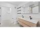 Modern bathroom with double sink vanity, sleek faucets, and contemporary fixtures at 1601 Park Ave # 307, Denver, CO 80218