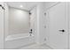 Bright bathroom featuring a tiled shower-tub, minimalist design, and modern fixtures at 1601 Park Ave # 307, Denver, CO 80218