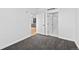 Bedroom featuring carpet, an air conditioning unit, and access to other rooms at 1601 Park Ave # 307, Denver, CO 80218