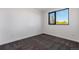 Bedroom featuring gray carpet, a large window, and neutral wall color at 1601 Park Ave # 307, Denver, CO 80218