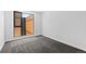Bedroom featuring gray carpet, a modern style window, and neutral wall color at 1601 Park Ave # 307, Denver, CO 80218
