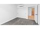Modern bedroom featuring a carpeted floor, minimalist design, and ample closet space at 1601 Park Ave # 307, Denver, CO 80218