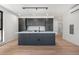 Bright kitchen area boasts a large island, modern lighting, and stainless appliances at 1601 Park Ave # 307, Denver, CO 80218