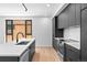 Modern kitchen featuring stainless steel appliances and a large island at 1601 Park Ave # 307, Denver, CO 80218